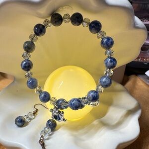 A Blue Jasper Stone Bracelet with Light Blue Shimmer Beads & dangling charms.